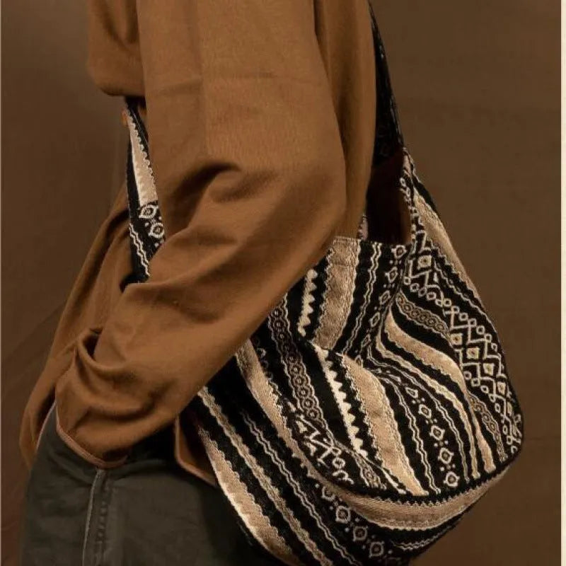 Corduroy vintage messenger bag with jacquard stripe pattern and adjustable plaid shoulder strap