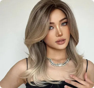 Mid-length curly synthetic wig in a gradient colour with long bangs and full-head coverage