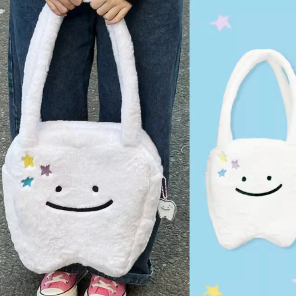 White plush large tooth shoulder tote bag with crossbody strap and zipper closure