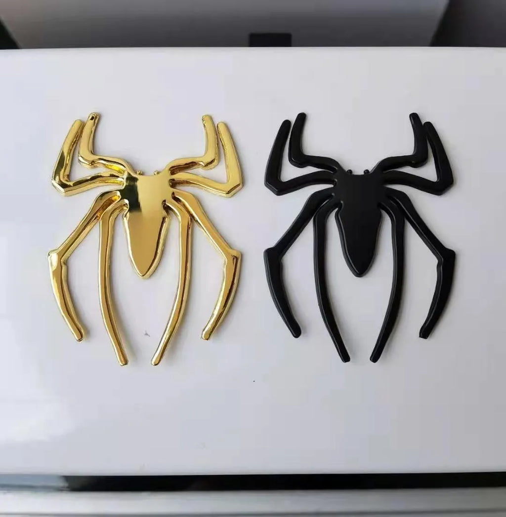 3D metallic spider bumper sticker in gold, silver, black, and red colour options.