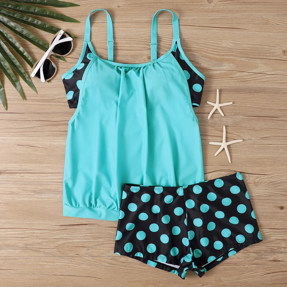 Black women's polka dot swimsuit with high-waist boxer brief bottoms.