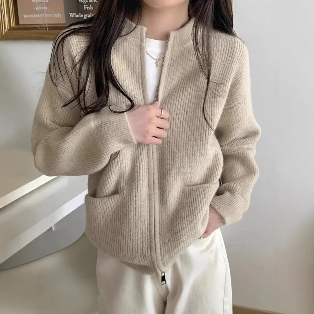 Beige viscose women's sweater coat cardigan with long sleeves laid flat.
