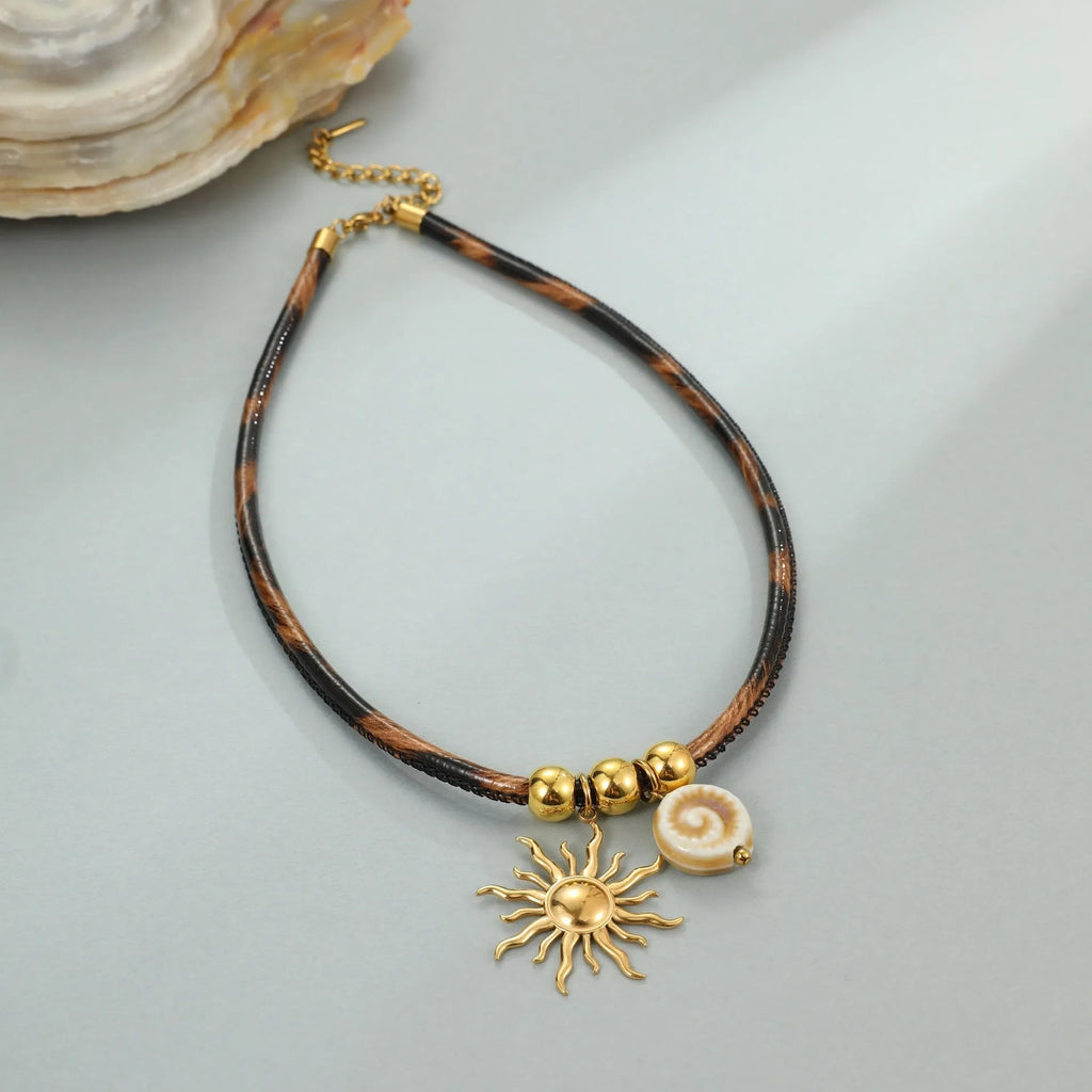 Geometric leopard pendant necklace on stainless steel chain with gold electroplated finish