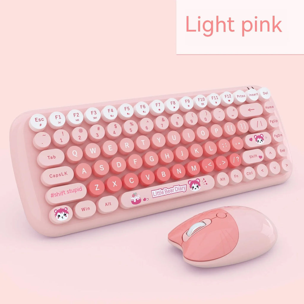 Pink wireless keyboard and mouse set with compact design on a desk