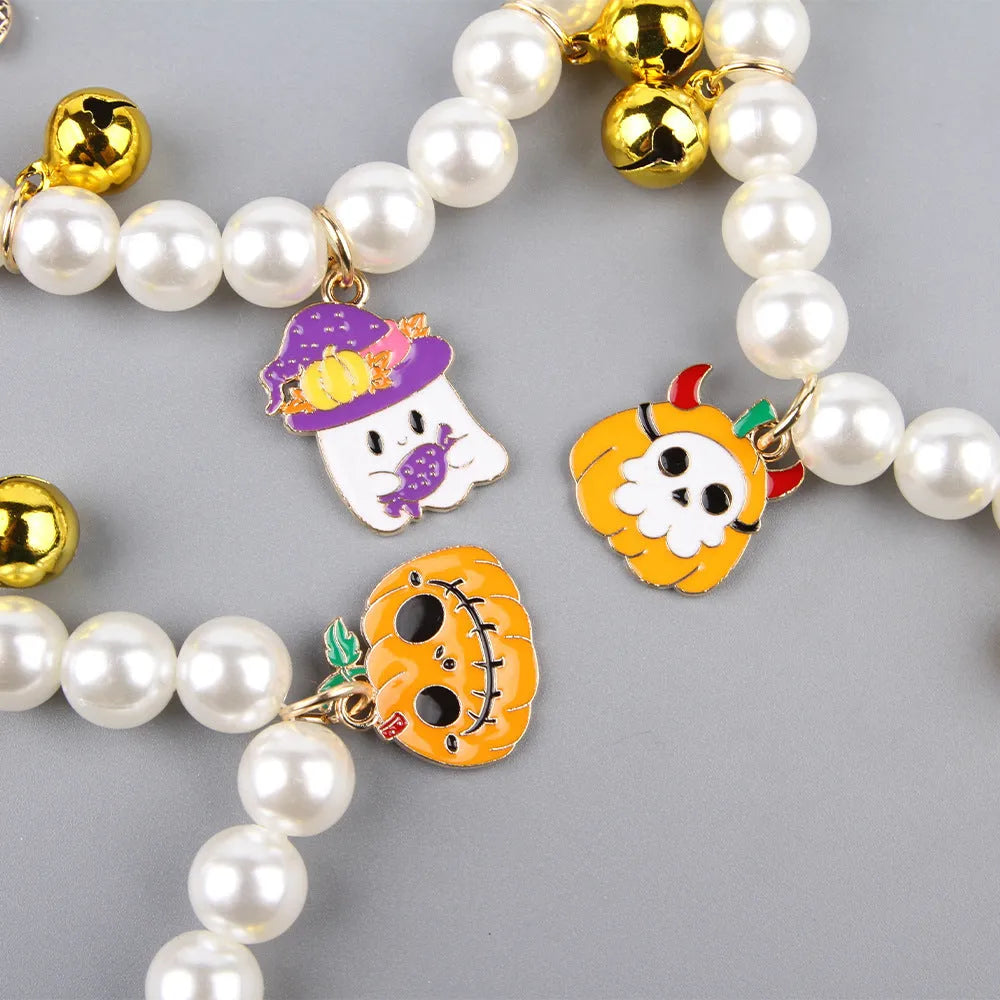 Purple simulated pearl Halloween cat collar decoration with a choice of ghost or pumpkin pendants.