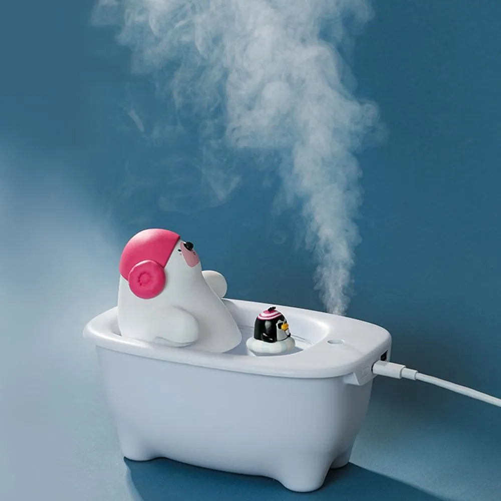 White polar bear-shaped USB air humidifier with water tank on a desk.