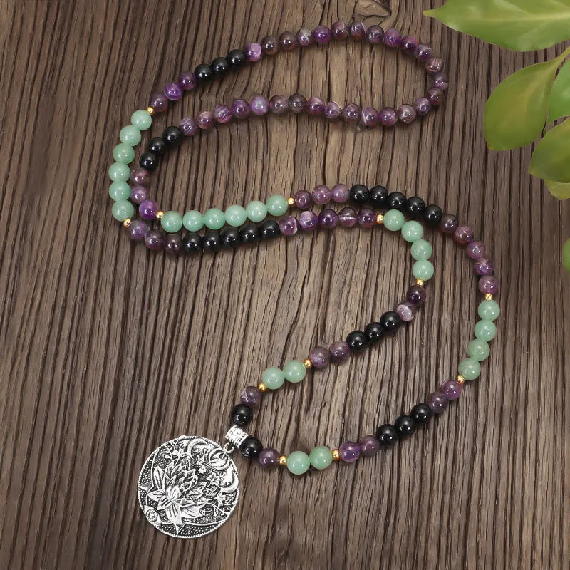 Dongling long yoga lotus pendant necklace and bracelet set with geometric alloy pendant and stone beads.