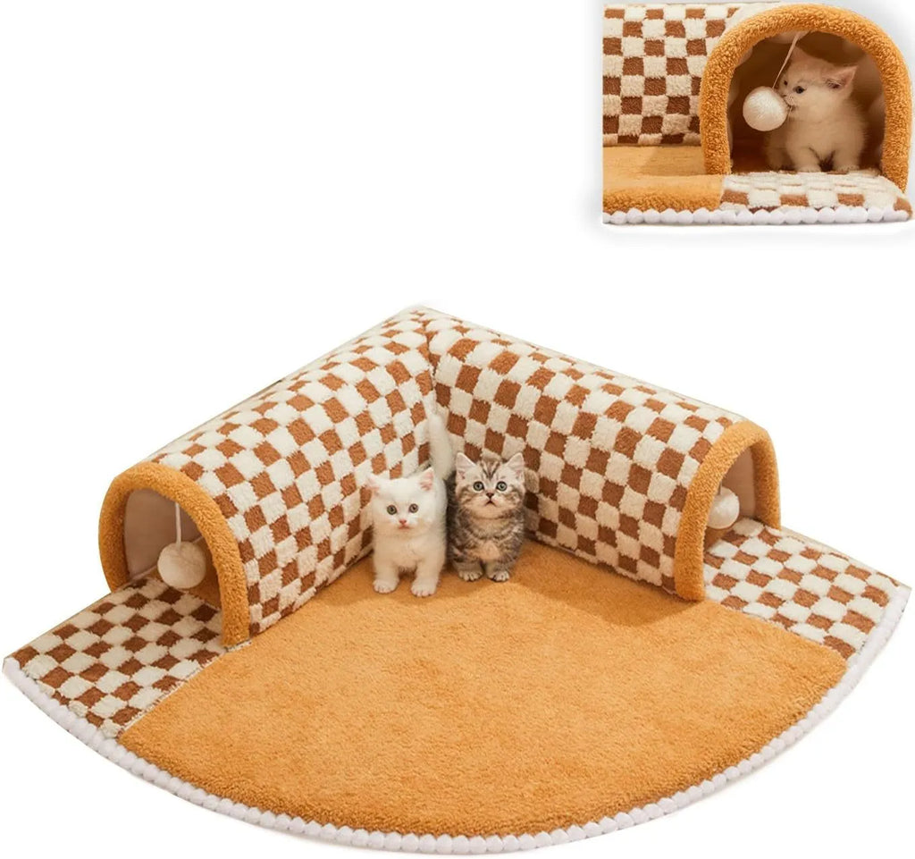 Brown plush plaid cat tunnel bed with central mat on a wooden floor.