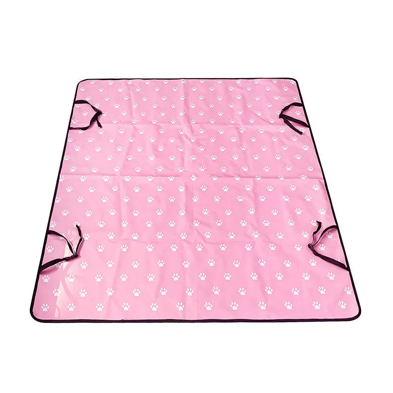 Dog car seat protector mat on rear bench seats in grey dog footprints pattern