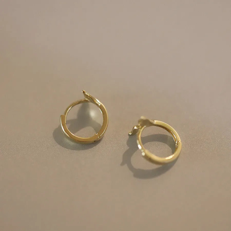 Gold plated fishtail earrings with S925 sterling silver construction and 8-10mm diameter