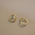 Gold plated fishtail earrings with S925 sterling silver construction and 8-10mm diameter