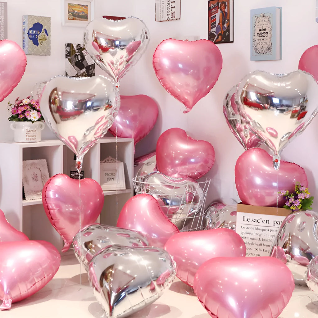 Five peach heart-shaped aluminium balloons in metallic colours for party decorations