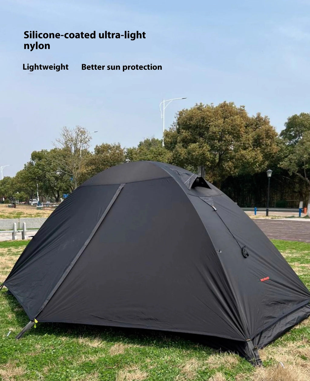 Single person camping tent with aluminium poles shown in expanded position with orange colour option