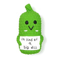 Green pickle-shaped squeaky dog chew toy with a textured surface for teeth cleaning.