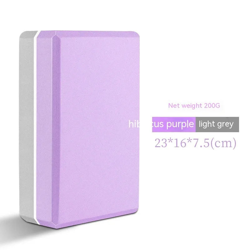 High-density EVA yoga block in violet colour next to a pink block with a cartoon print design.