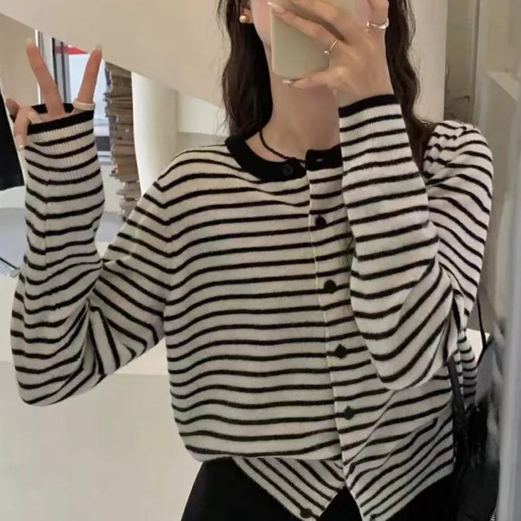 Dark grey and white striped slim fit women's cardigan with long sleeves.