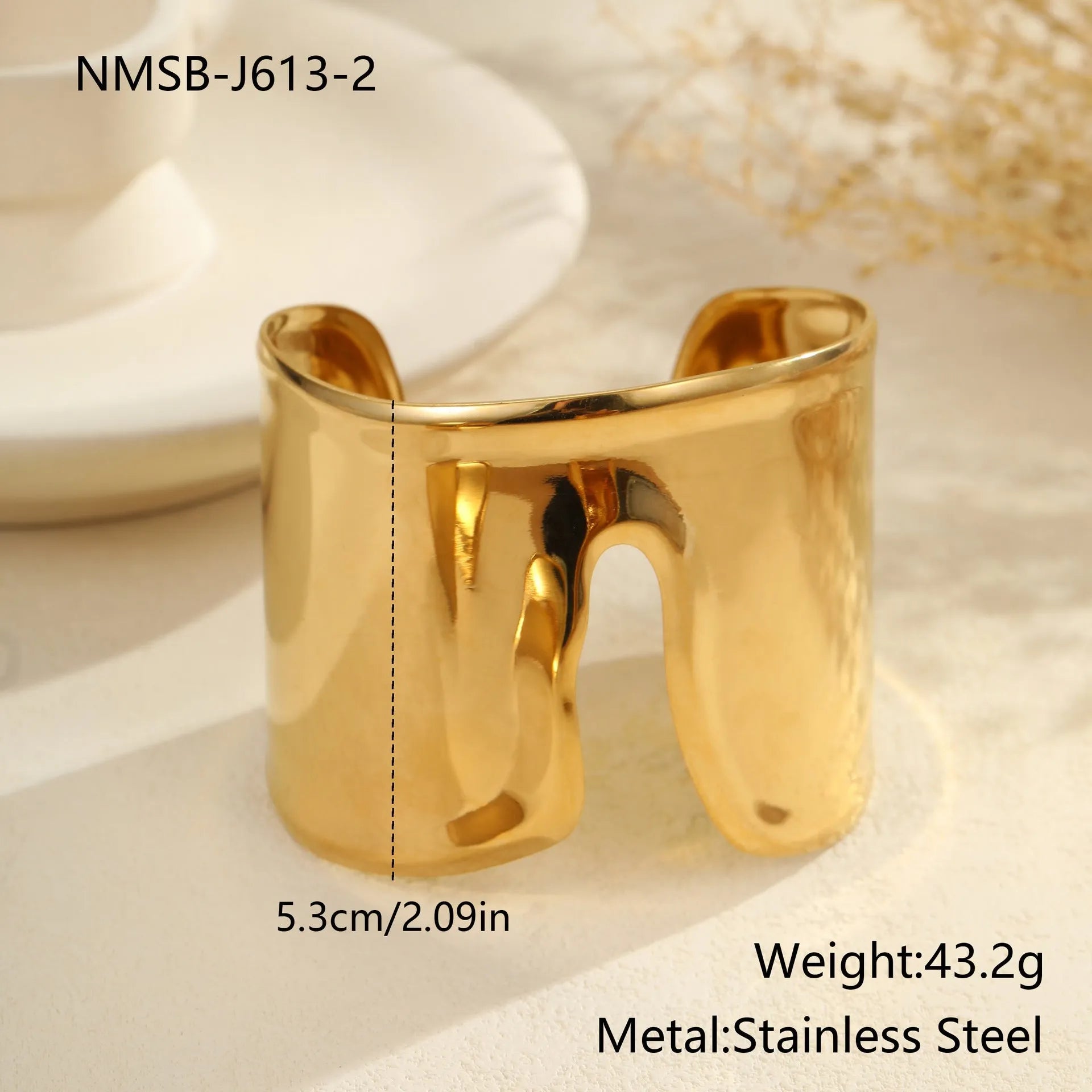 Women's exaggerated wide stainless steel bracelet with 18K gold plating and geometric wave design