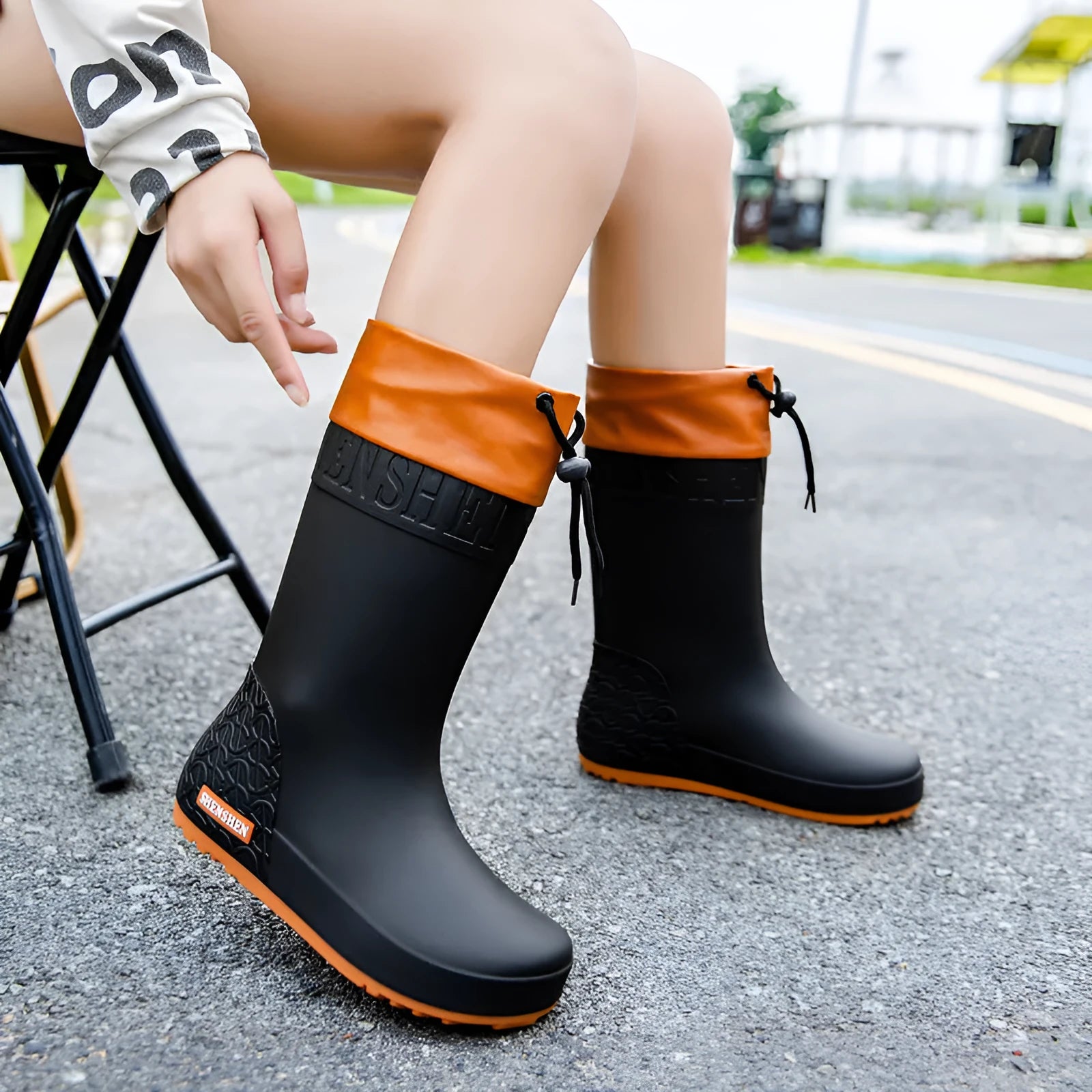 Women's PVC rain boots in apricot colour with non-slip soles and waterproof mouth detailing