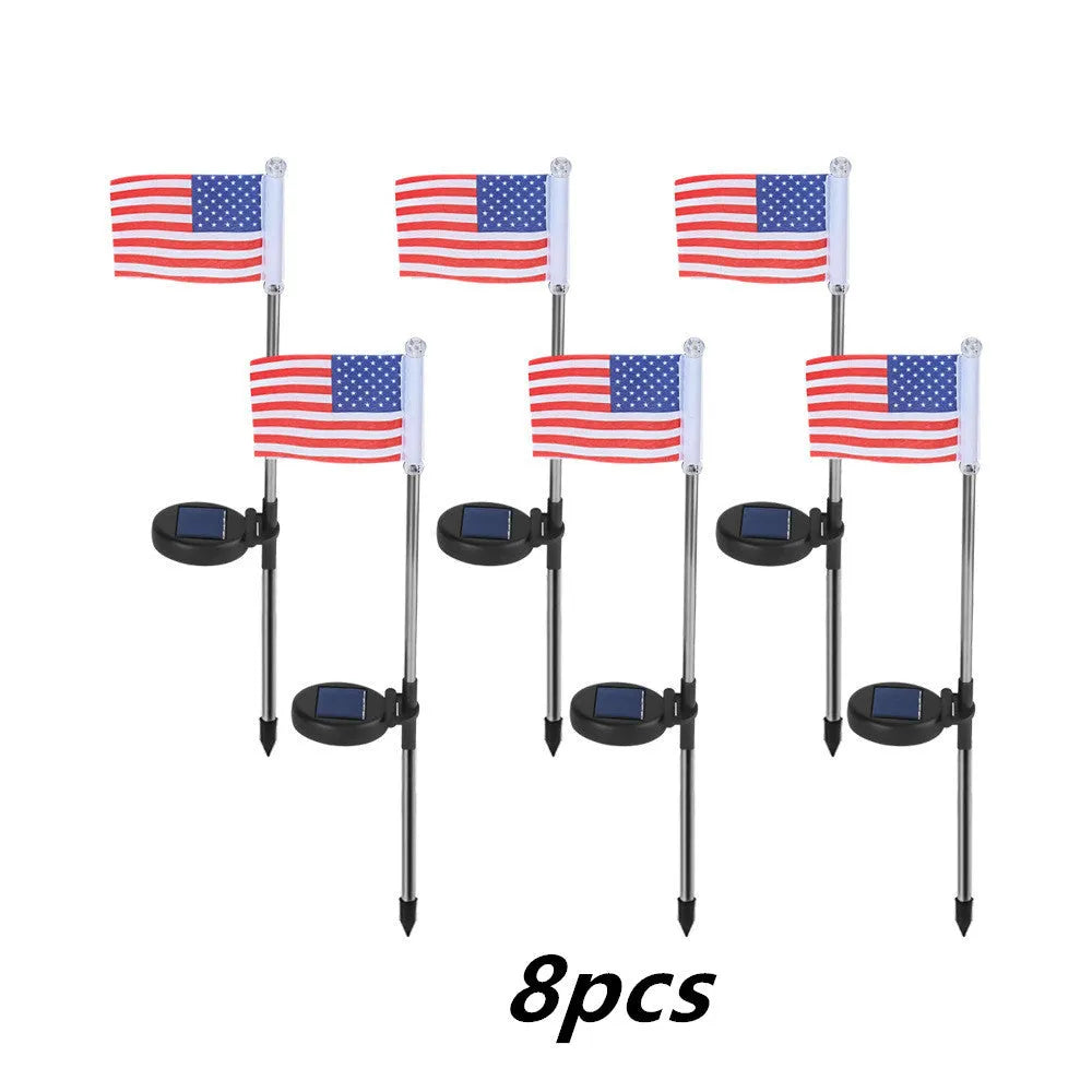 Solar garden flag light with stainless steel pole showing either American or British flag design.