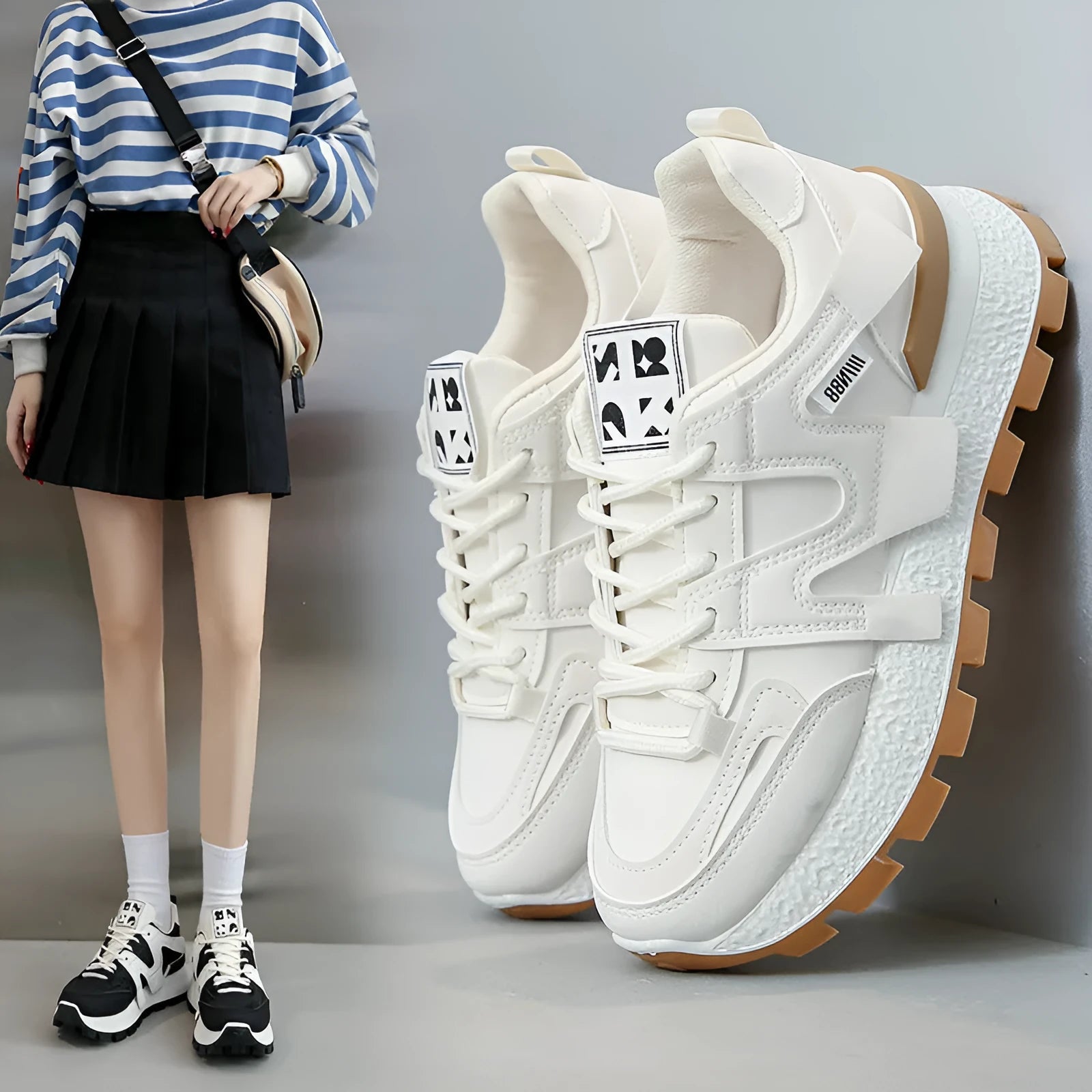 Unisex low-top running sneaker in black with round toe, lace-up front, and rubber sole on a white background.