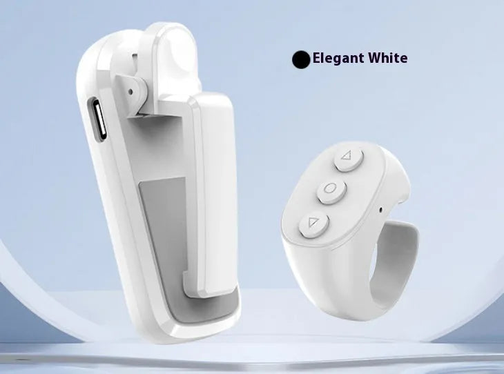 A black wireless remote and a foot pedal page turner clicker for tablets and e-readers