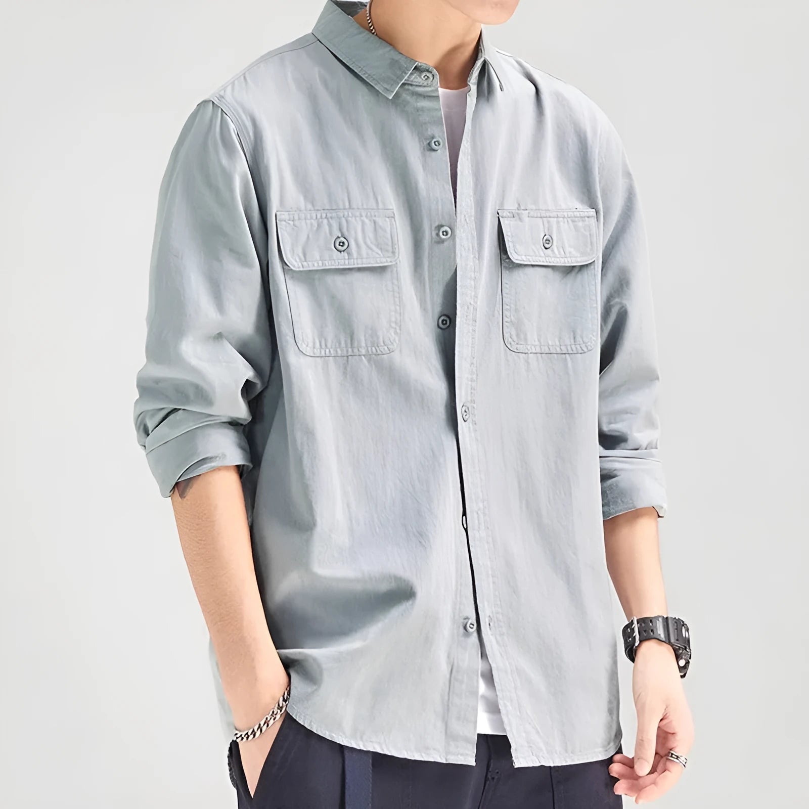 Men's loose long sleeve polyester shirt in cardigan style on a hanger, shown in light grey colour