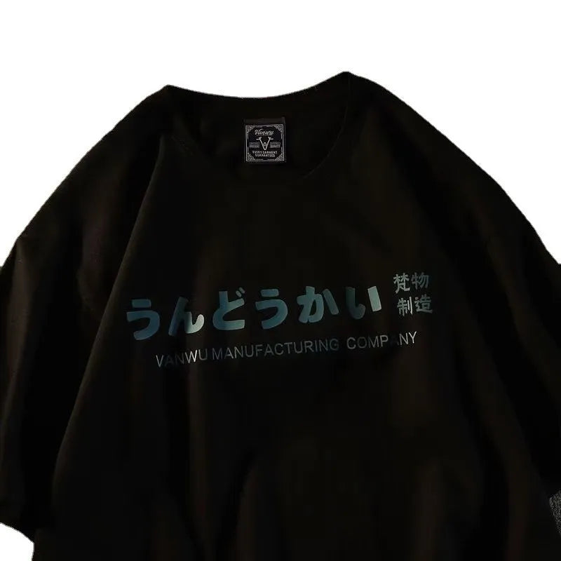 A loose-fitting black short sleeve cotton T-shirt laid flat on a surface.