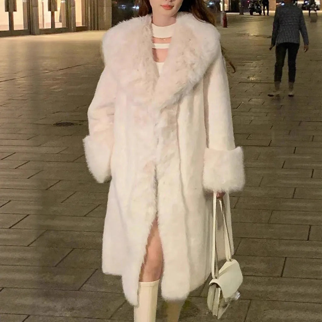 Women's thick grey faux rabbit fur mid-length coat with leather accents and a fur collar.