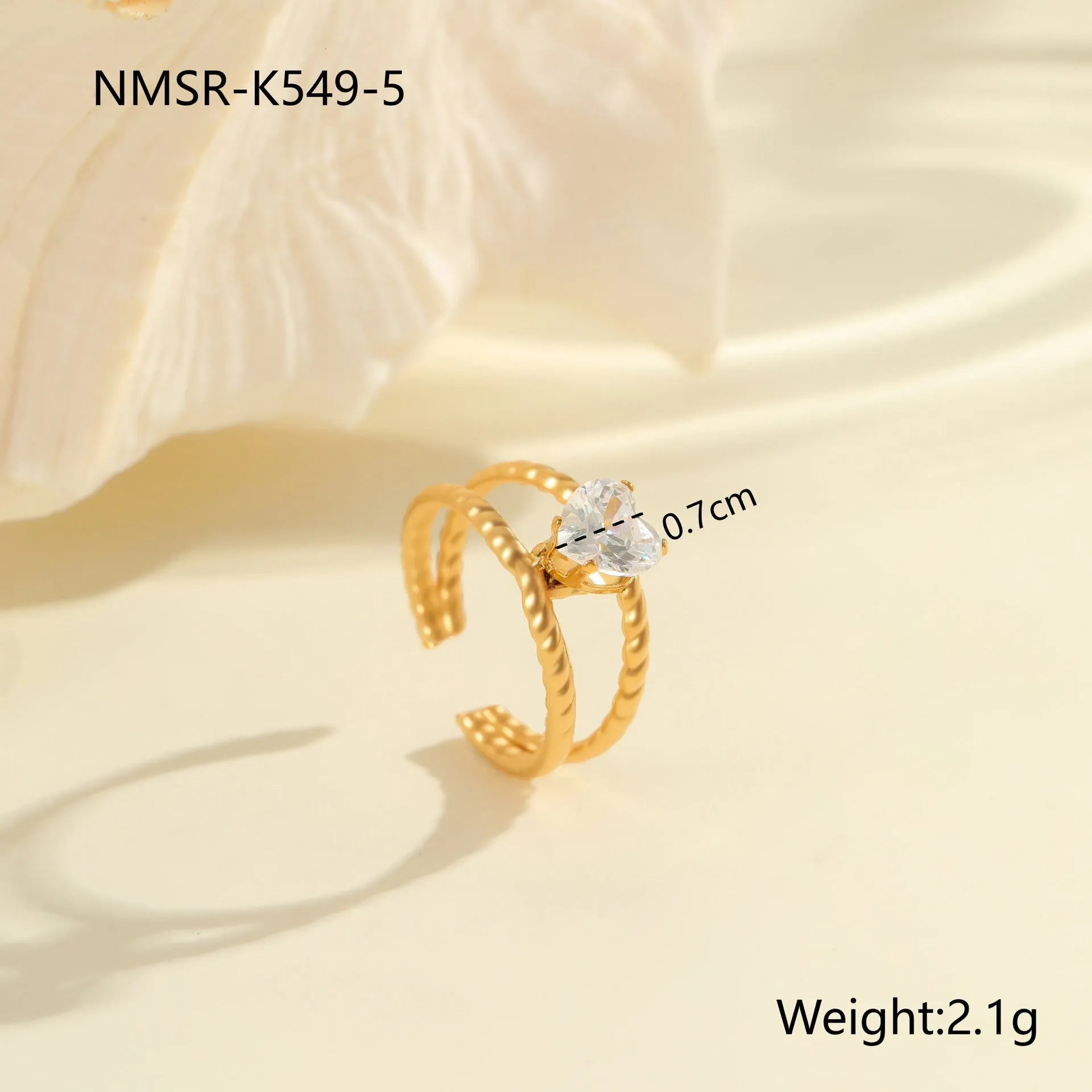 Gold-coloured stainless steel open ring with zircon stones in a geometric heart design.