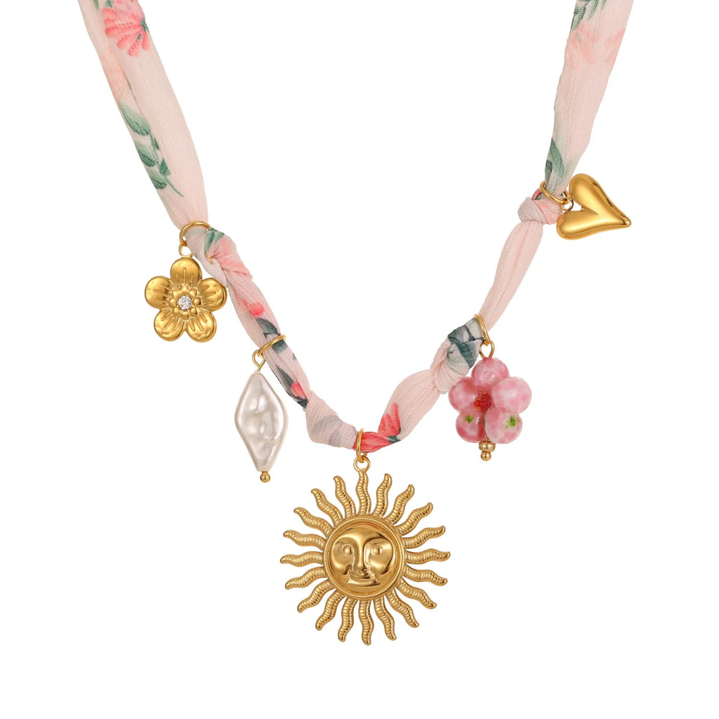 Stainless steel necklace with geometric sun pendant on regular chain, 18K electroplated finish