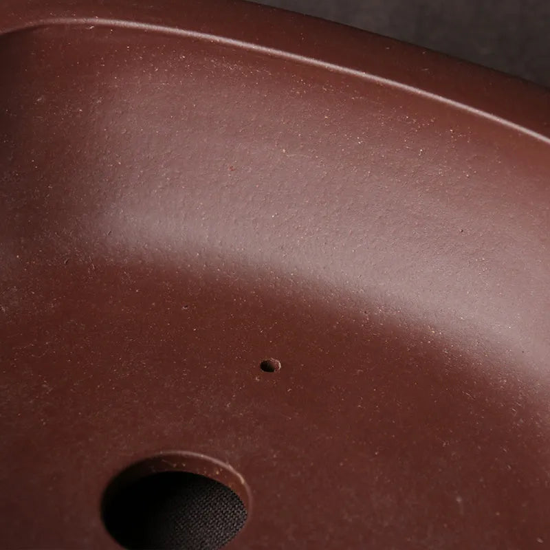 Handmade purple clay bonsai basin measuring 25x20x7 cm with classical Chinese design