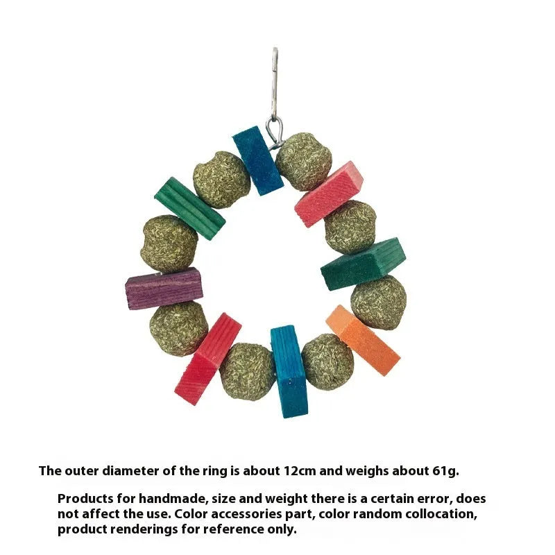 Applewood and straw ball ring chew toy for hamsters, guinea pigs, and rabbits on a white background.