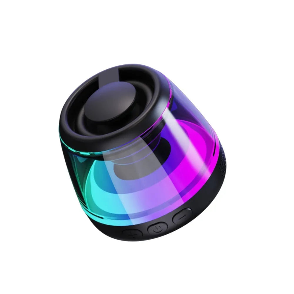 Small black or white portable Bluetooth speaker with a magnetic base and built-in lighting.