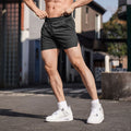 Men's straight-leg polyester sports shorts in black, available in sizes up to 3XL