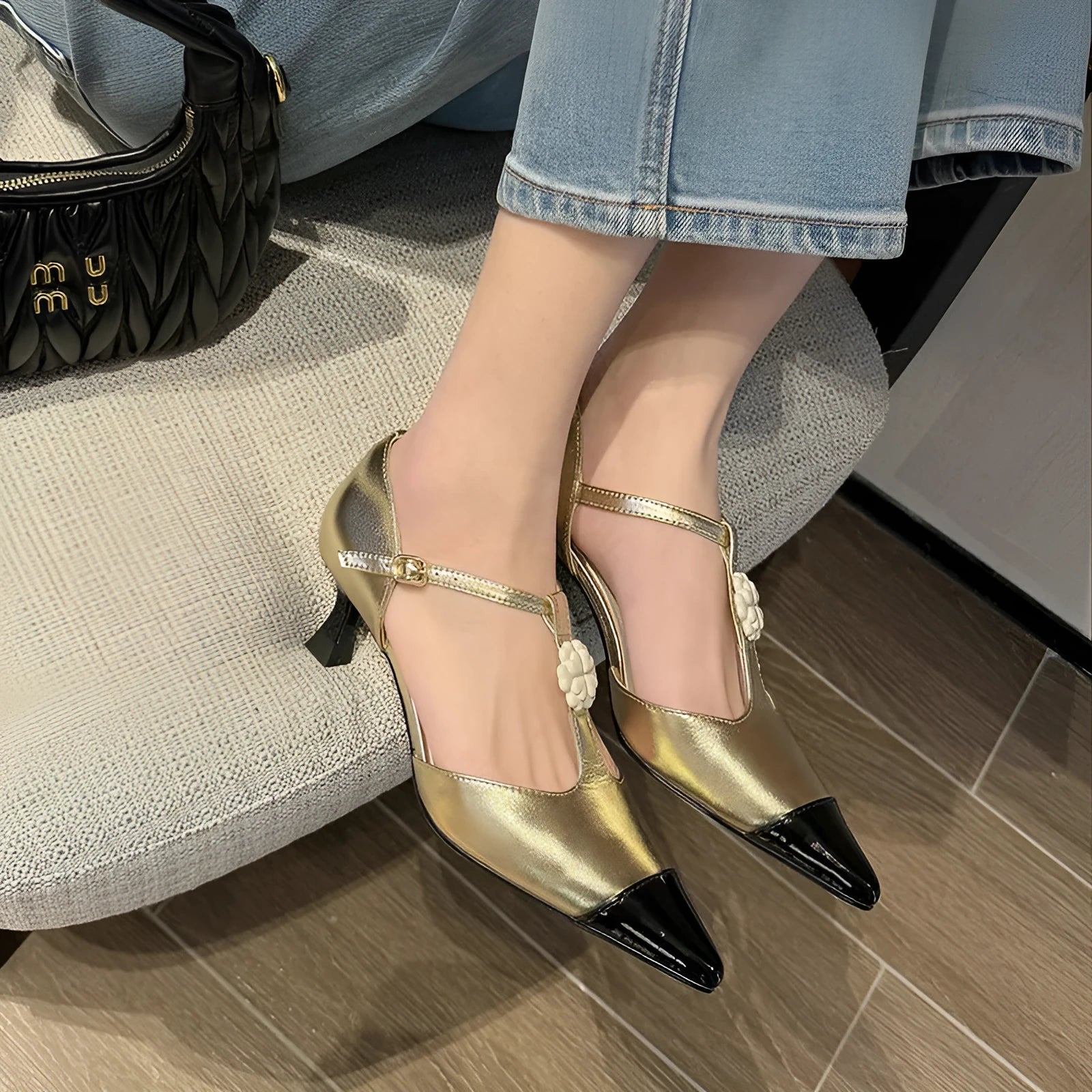Women's gold stiletto heel pointed toe shoes with floral buckle on sheepskin leather upper