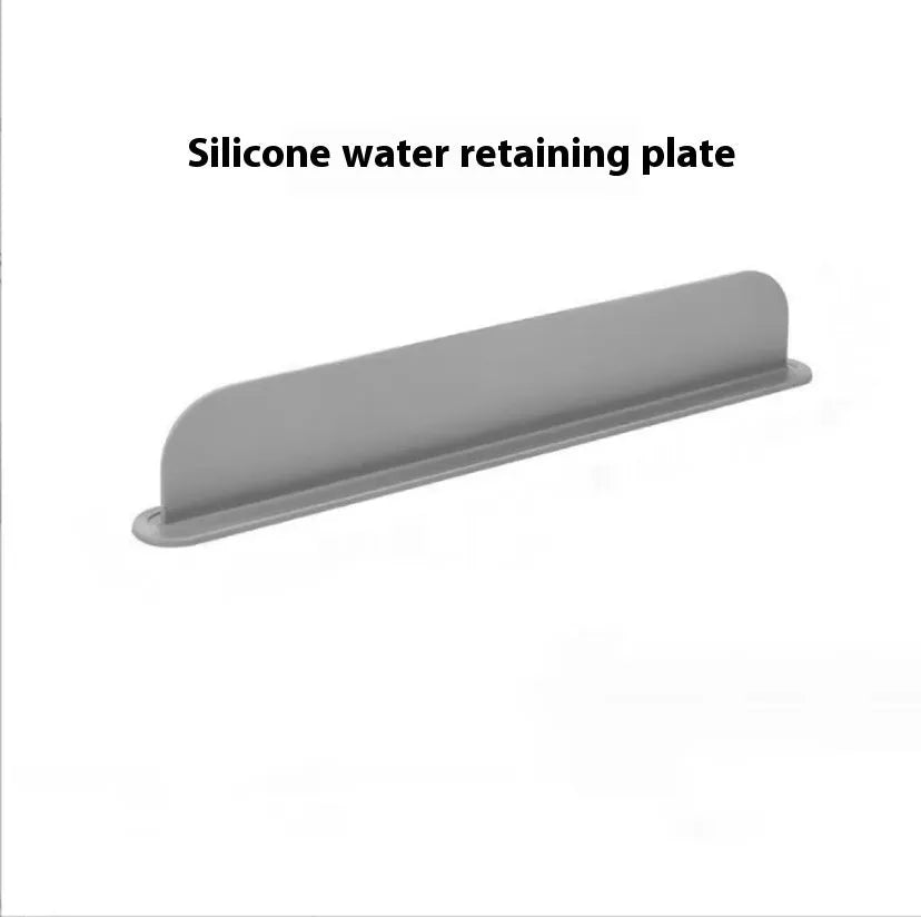 Thick grey silicone sink splash guard fitted on a kitchen sink edge