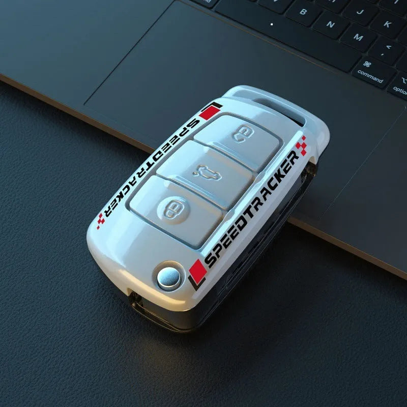 Carbon fibre style car key holder cover in white and carbon colour options with a small mirror.