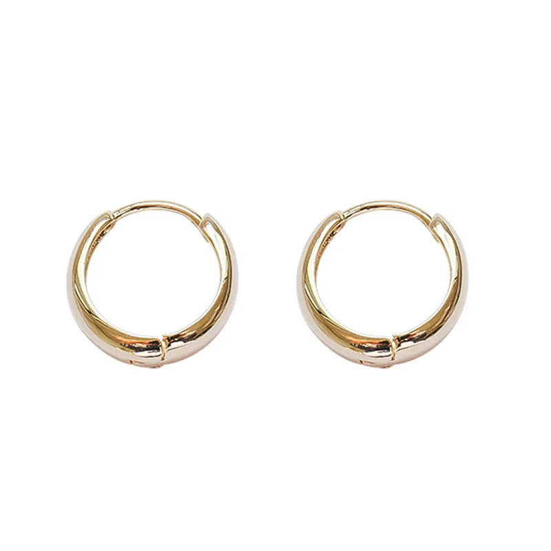 Women's geometric water drop earrings in gold and silver with minimalist round design