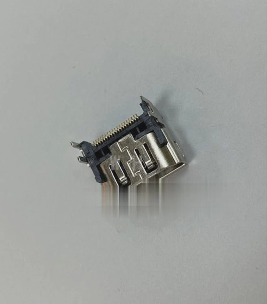 Silver-coloured HDMI host socket interface for game console repair.