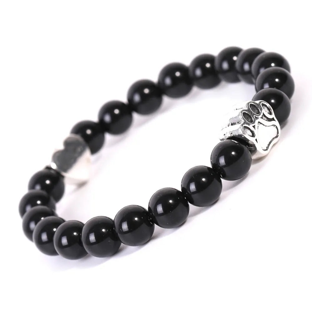 Tigereye Indian Agate stone bracelet with dog paw and love heart charms on wrist.