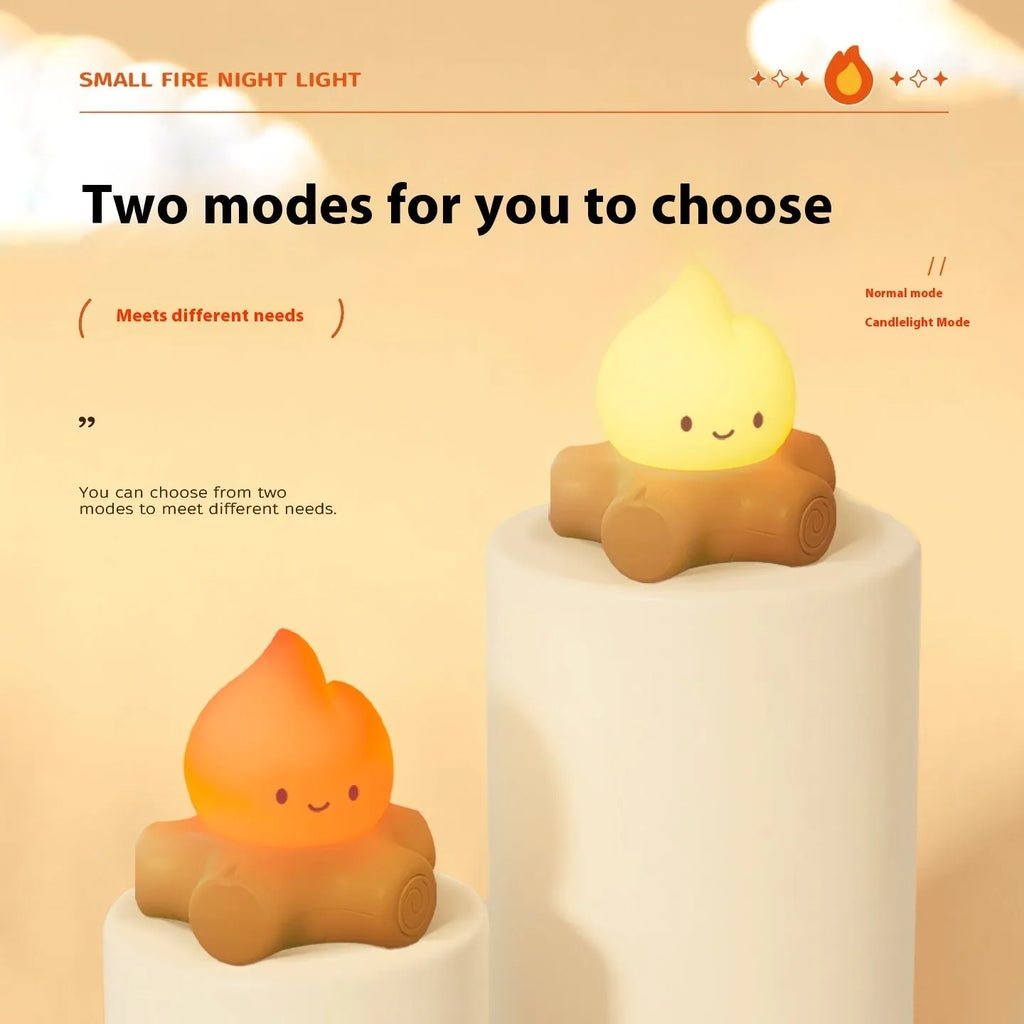 Small Fire Pile cartoon-themed silicone night light with yellow glow on a table.