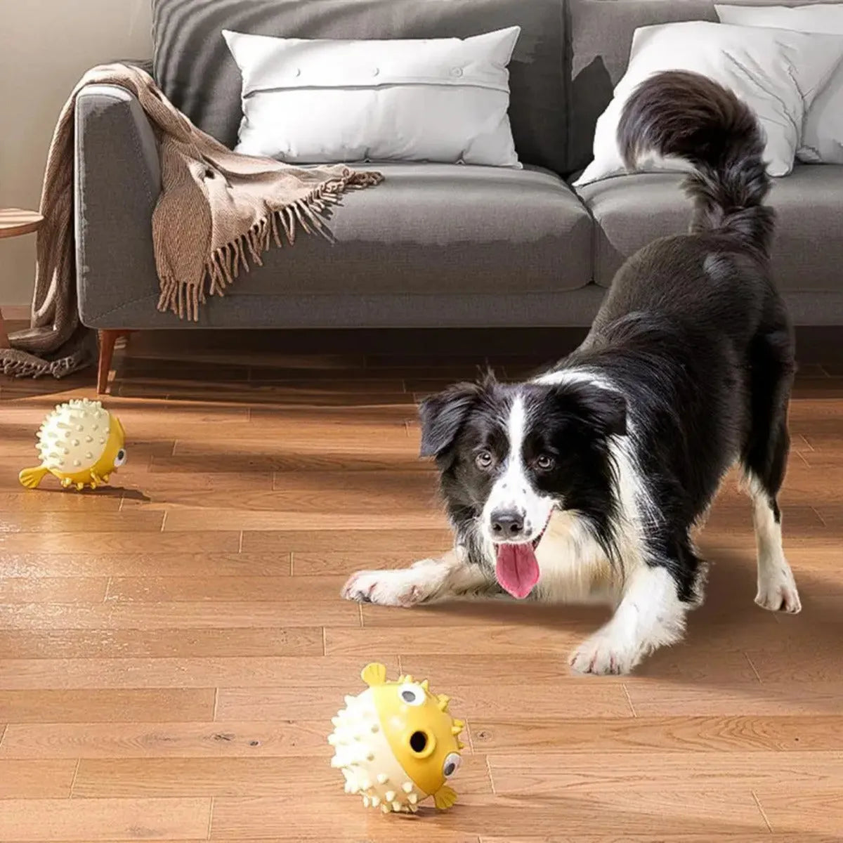 Yellow fish-shaped dog chew toy with convex texture and squeaker for aggressive chewers