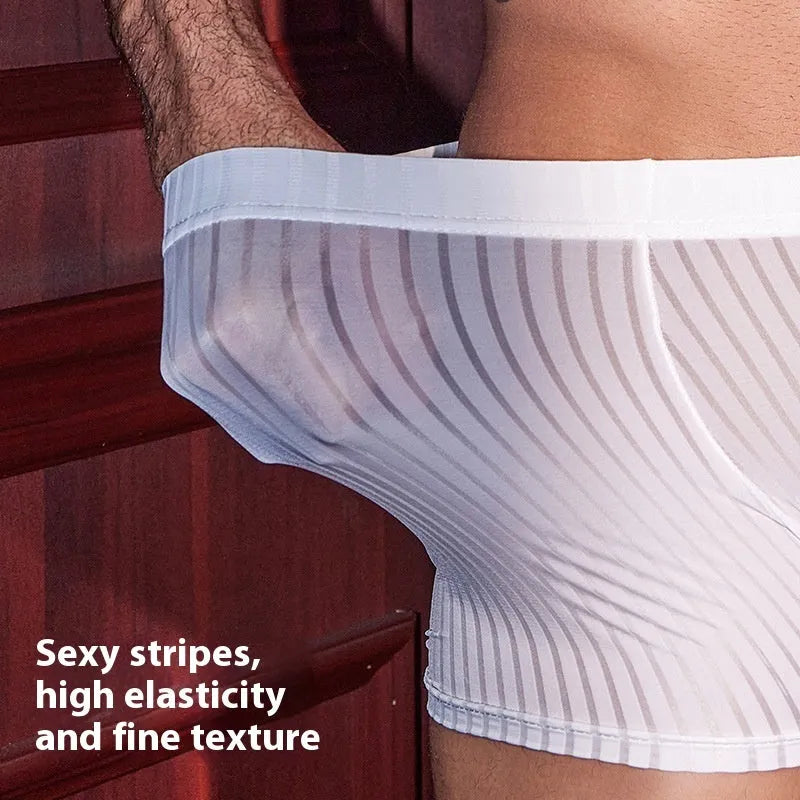Men's black striped boxer briefs made from nylon fabric on a grey background.