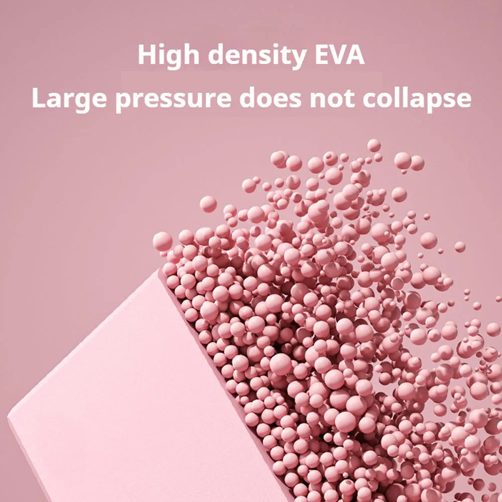 Solid colour high-density EVA foam yoga block with ridged sides on a gym mat