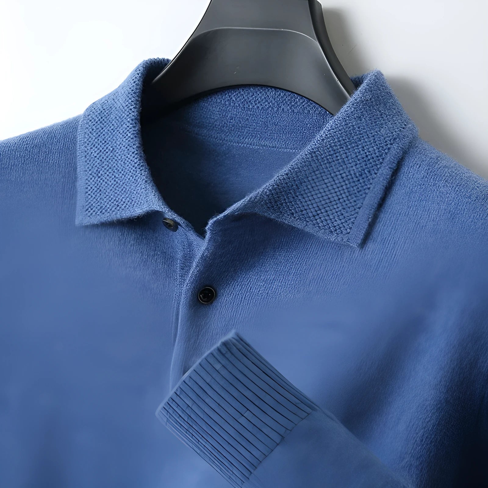 Man wearing a men's grey polo collar wool sweater pullover with long sleeves.
