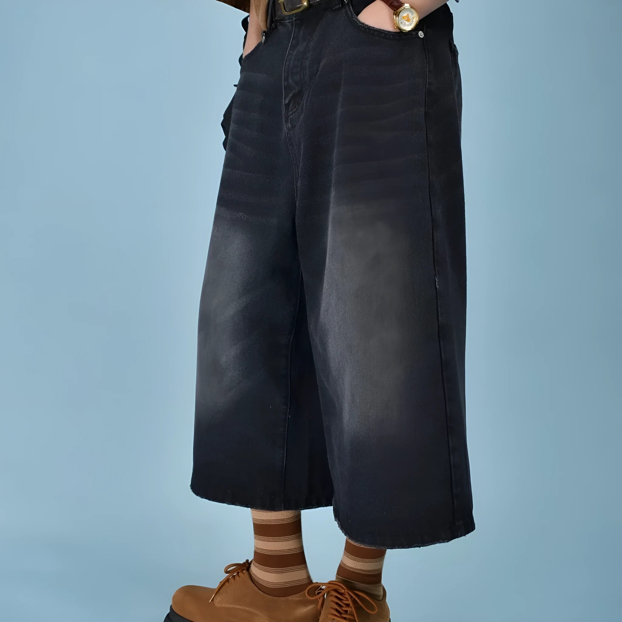 Men's straight-leg loose fit denim shorts in light blue on a neutral background.