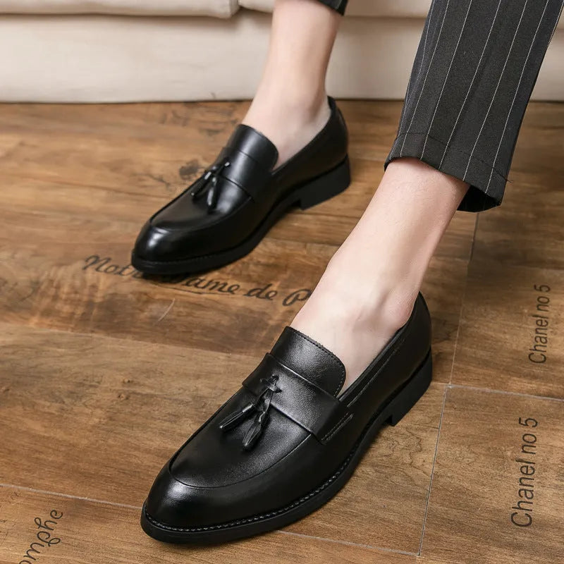 Men's black slip-on business shoes with tassel detail on artificial leather upper