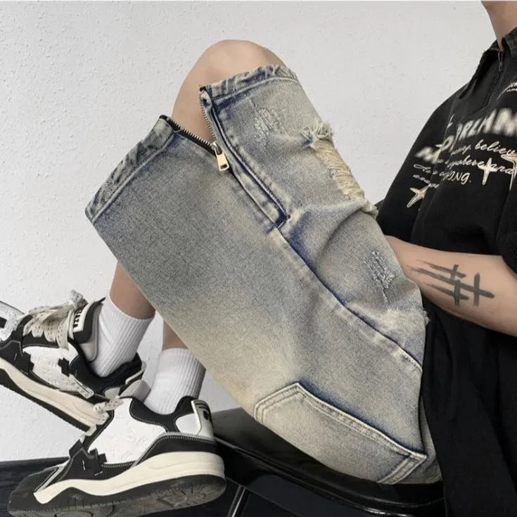 Blue distressed denim shorts with wide-leg loose fit and retro tattered styling on hanger