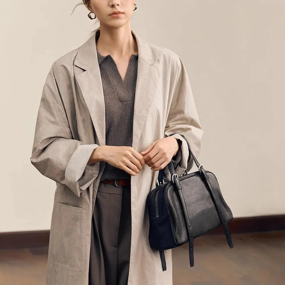 Women's black genuine leather retro shoulder bag showing horizontal square shape and double shoulder straps