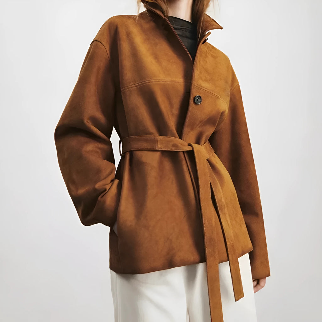 Women's mid-length art retro cashmere coat with Peter Pan collar and leather stitching in loose fit.